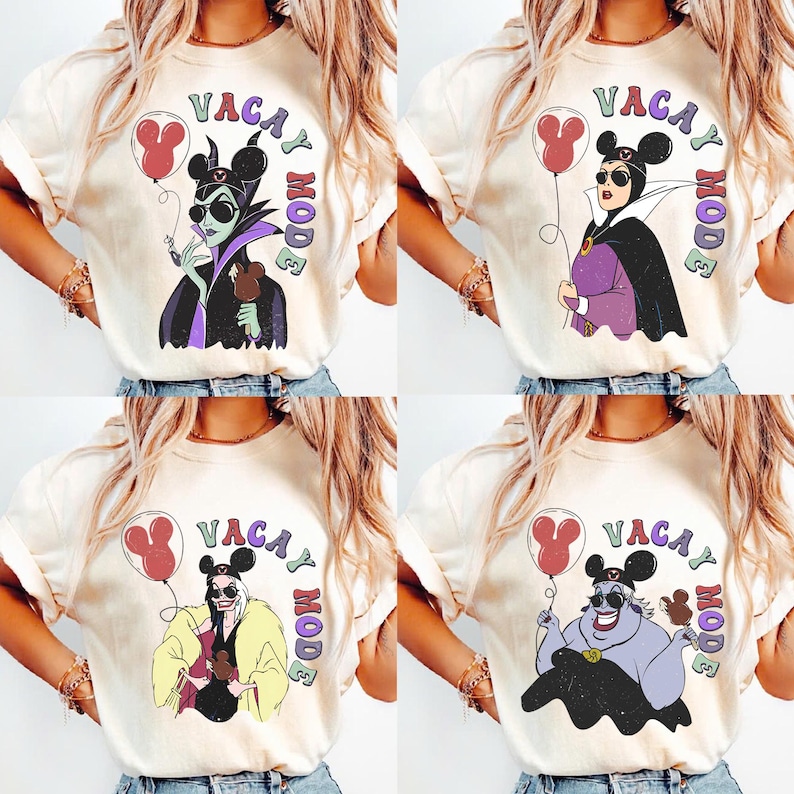 May include: Four cream-colored t-shirts with the phrase "Vacay Mode" and cartoon illustrations of Disney villains. Each shirt features a different villain holding a balloon and a snack, with a Mickey Mouse ear design.