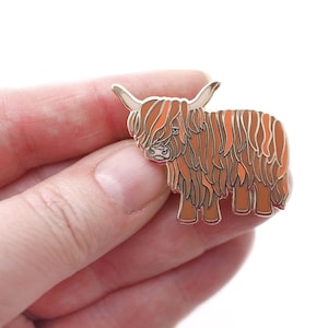 Highland cow enamel pin. Scottish animal design.
