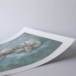 May include: A print featuring a serene scene of two polar bears resting on a light blue surface. The artwork has a soft, painterly style, with the bears rendered in shades of white and gray.