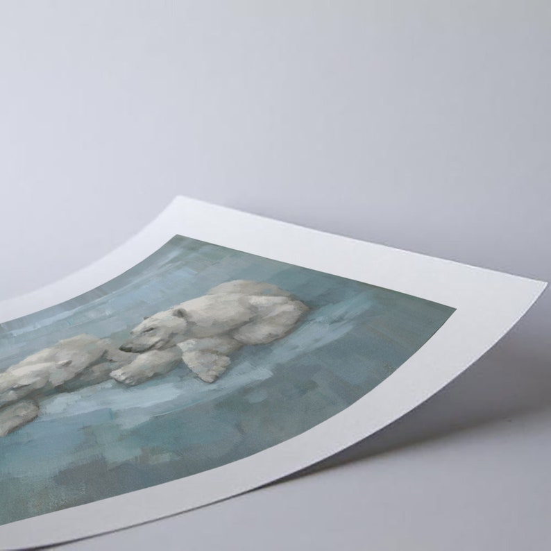 May include: A print featuring a serene scene of two polar bears resting on a light blue surface. The artwork has a soft, painterly style, with the bears rendered in shades of white and gray.
