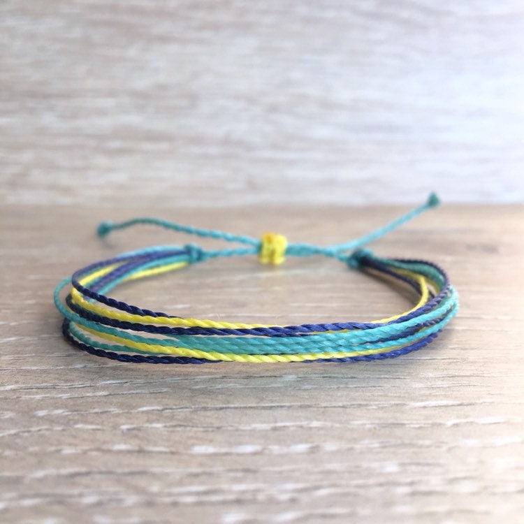 Adjustable beach bracelet blue and yellow waxed cord beach | Etsy