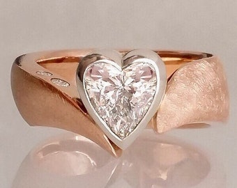 Heart moissanite engagement ring, two tone bezel set modern ring
