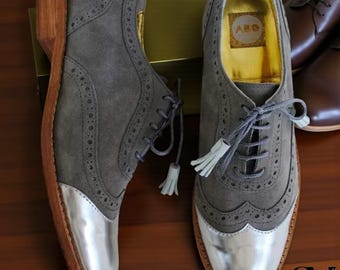Handgemaakte grijze Oxford-schoenen met vleugelneus en vetersluiting voor dames, gemaakt van hoogwaardig leer en suède, geschikt voor formele gelegenheden.