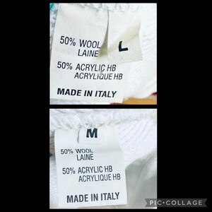 Op de afbeelding: Twee witte kledinglabels met zwarte tekst. Het bovenste label heeft een "L" en het onderste label heeft een "M". Beide labels lezen "50% WOOL LAINE", "50% ACRYLIC HB ACYLIQUE HB" en "MADE IN ITALY".
