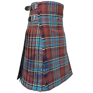 May include: A tartan kilt in a colourful pattern of red, blue, and white checks. It has black leather straps with buckles and a fringed edge. The pleated design is a traditional feature of this Scottish garment.