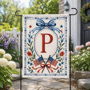 May include: A garden flag featuring a patriotic design with the letter "P". The flag has a cream background with a blue bow, red stars, and floral accents. Two American flags are crossed at the bottom.