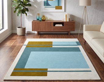 Blauw mosterdkleurig geometrisch wollen vloerkleed in mid-century stijl met kleurblokken. Verkrijgbaar in de maten 3x4, 8x10 en 9x12.