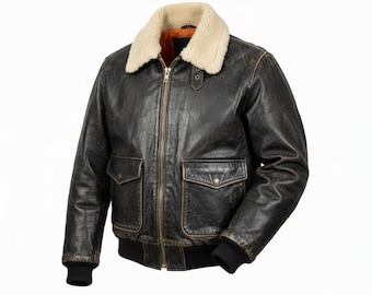 May include: A distressed black leather bomber jacket with a cream-colored shearling collar. The jacket features two front pockets, a zip-up closure, and black ribbed cuffs and hem. The interior lining is orange.
