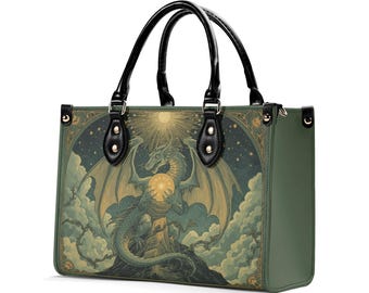 May include: Green tote bag featuring a fantasy illustration of a dragon holding a glowing orb, set against a starry night sky and clouds. The bag has black handles and trim.