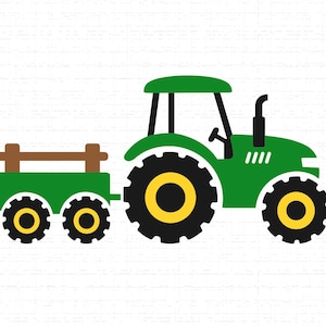 May include: A green tractor with black and yellow wheels and a brown trailer. The tractor has a green cab and a black exhaust pipe. The trailer has two sets of wheels and a brown wooden fence.