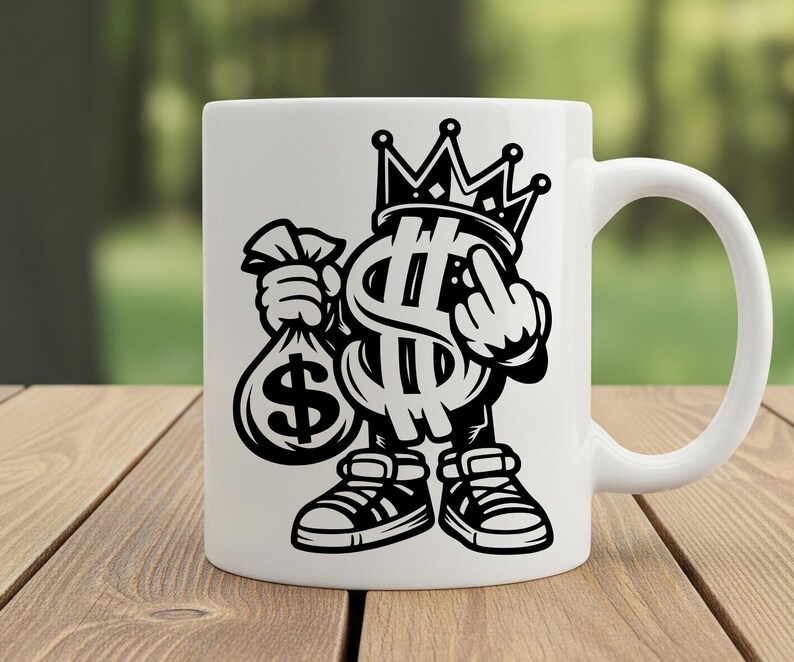 May include: White ceramic mug featuring a black and white cartoon dollar sign character wearing a crown and sneakers, holding a money bag and giving the middle finger. The mug has a curved handle.