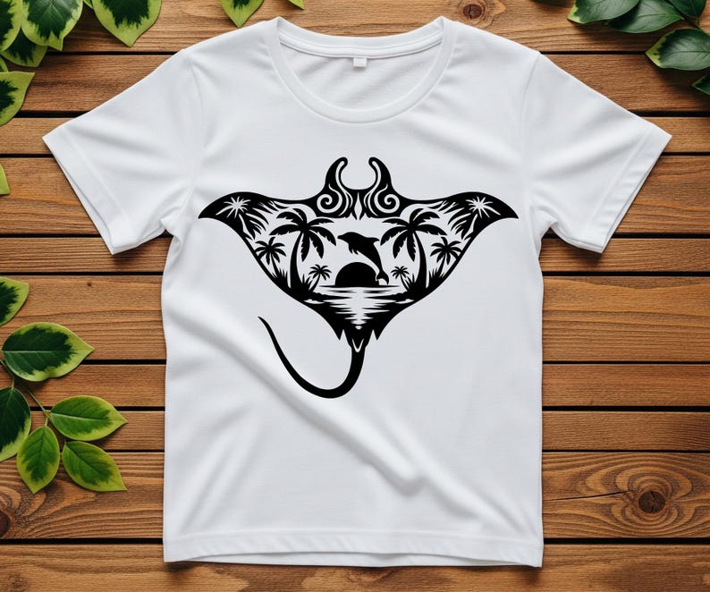 May include: White t-shirt featuring a black graphic of a manta ray with a tropical scene inside. The design includes palm trees, a dolphin leaping over the sun, and ocean waves. The shirt is made of a soft, lightweight material.