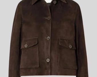 May include: A dark brown suede jacket with a collared neckline, button closures, and two front pockets. The jacket has a classic design and a tailored fit, suitable for various occasions. The jacket is a versatile outerwear piece.