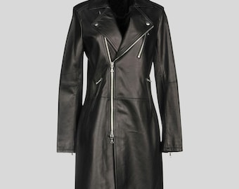 May include: A long black leather jacket with a classic biker jacket design. Features include a notched collar, asymmetrical zipper closure, and multiple zippered pockets. The jacket has a tailored fit and a sleek, modern aesthetic.