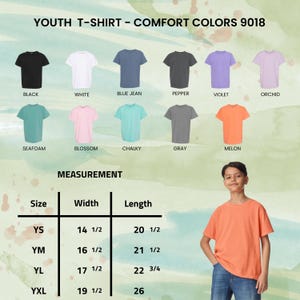 May include: A youth t-shirt in melon color is modeled in the image. The image also displays a color chart of other t-shirt colors, including black, white, blue jean, pepper, violet, orchid, seafoam, blossom, chalky, and gray. Measurement details are also provided.