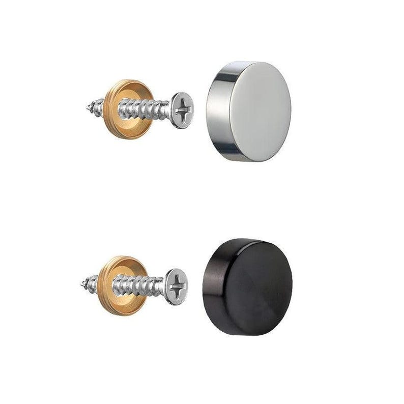 May include: Two sets of hardware components. One set includes a silver-colored, circular cap and a screw with a brass-colored washer. The other set features a black, circular cap and a screw with a brass-colored washer.
