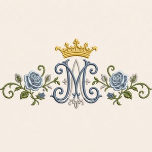 May include: An embroidery design featuring a central blue letter M with a gold crown positioned above it. The letter is flanked on both sides by light blue roses, green leaves, and swirling stems, creating a symmetrical floral arrangement.