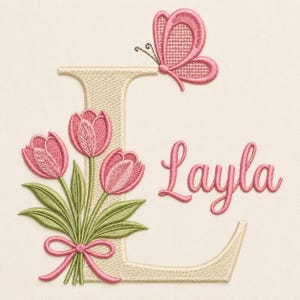 May include: Embroidered design featuring the name "Layla" in pink script, a pink butterfly, and a bouquet of pink tulips with green leaves. The letter "L" is in a beige color. A pink bow ties the tulips together.