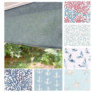 May include: A window valance in a textured, light blue fabric is shown, with a view of greenery outside. Additional fabric swatches display coral, sailboat, anchor, and starfish patterns in shades of blue, white, and coral.