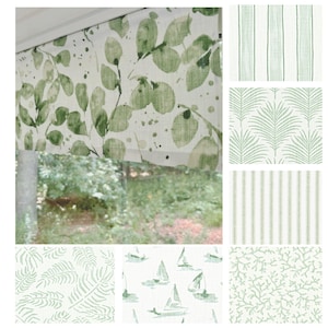 May include: A collection of fabric swatches featuring various green and white patterns. The top swatch displays a leaf design, while others showcase stripes, palm fronds, sailboats, and coral. These fabrics are suitable for home decor projects.