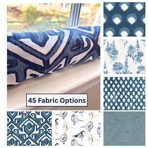 May include: A window seat cushion with a blue and white geometric pattern is displayed, alongside samples of various fabric patterns. The image includes a text box that reads "45 Fabric Options". The fabric samples showcase floral, dotted, and textured designs in shades of blue.