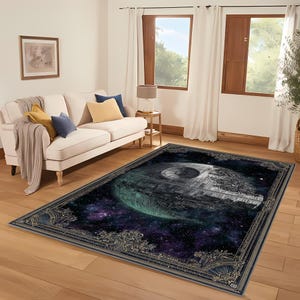 May include: Rectangular area rug featuring a Death Star design against a starry space background. The rug has a dark border with ornate detailing. The color palette includes shades of gray, green, blue, and purple. The rug is placed on a hardwood floor.
