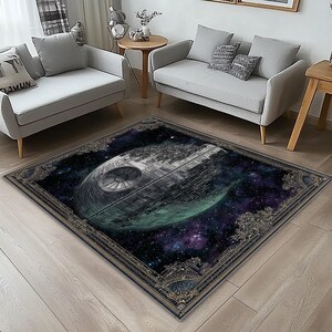 May include: A rectangular area rug featuring a detailed image of a space station against a backdrop of a nebula. The rug has a dark border with ornate detailing, and is placed on a light wood floor.