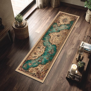 May include: A rectangular rug with a vintage map design. The rug features a teal blue river winding through a tan and brown landmass, with illustrations of ships and a compass rose. The border is a light beige.