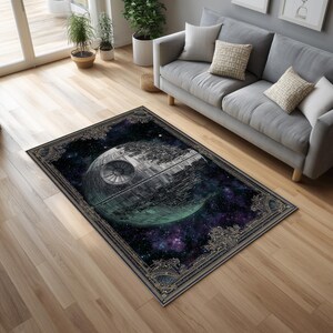 May include: A rectangular area rug featuring a detailed illustration of a Death Star against a space background with a galaxy of purple and blue hues. The rug has a decorative border.