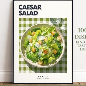 May include: A framed wall art print featuring a Caesar salad in a bowl on a green and white chequered tablecloth. The text reads CAESAR SALAD, MEXICO, A TASTE OF HOME, ROOTED & ROAMING, and 100+ DISHES FIND YOUR TASTE OF HOME. The print includes space for personalisation.