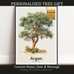 May include: A framed art print featuring a watercolor illustration of an Argan tree, Argania spinosa. The tree has a brown trunk and green foliage. The print includes the text "Argan" and "Custom Name, Date & Message". A gold ribbon says "Perfect Gift Idea".