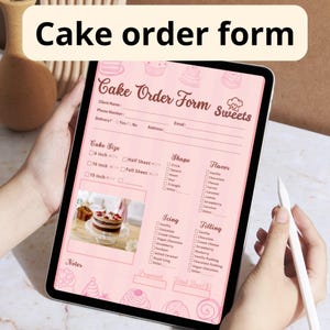 May include: A digital tablet displaying a pink cake order form with the text "Cake Order Form Sweets." The form includes sections for cake size, shape, flavor, icing, and filling. A stylus is held in the hand.