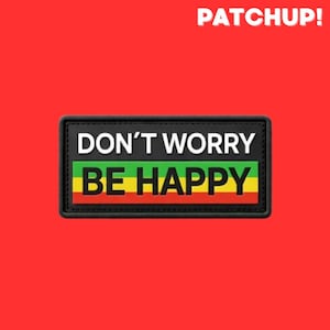 Pode incluir: Um patch retangular com as palavras "DON'T WORRY BE HAPPY" em texto branco e preto. O patch tem uma borda preta e um design de listras verdes, amarelas e vermelhas. A palavra "PATCHUP!" está em texto branco no topo.