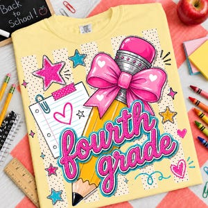May include: A pale yellow t-shirt featuring a graphic of a yellow pencil with a large pink bow, a piece of lined notebook paper, and the text "fourth grade" in pink script. The design includes pink and teal stars and small hearts.