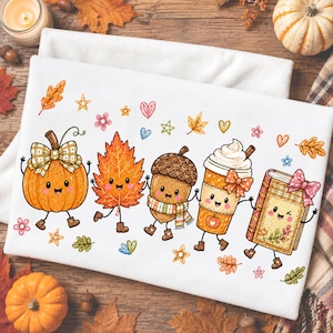 May include: A white fabric featuring a colorful graphic print of five anthropomorphic autumn characters: a pumpkin with a plaid bow, an orange maple leaf, an acorn wearing a scarf, a whipped cream coffee cup, and a book, all surrounded by small hearts, stars, and flowers.