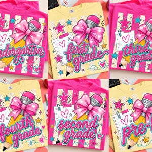 May include: A collection of six t-shirts in pink and yellow, each featuring a graphic of a yellow pencil with a large pink bow, a notepad with a heart, and stars. The shirts display the text kindergarten, first grade, third grade, fourth grade, second grade, or pre-k.