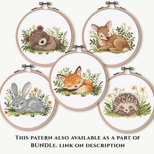 May include: Five cross-stitch embroidery hoops featuring woodland animals: a bear, deer, fox, rabbit, and hedgehog. Each animal is depicted sleeping amidst greenery and flowers. The text at the bottom reads, "THIS PATTERN ALSO AVAILABLE AS A PART OF BUNDLE. LINK ON DESCRIPTION."