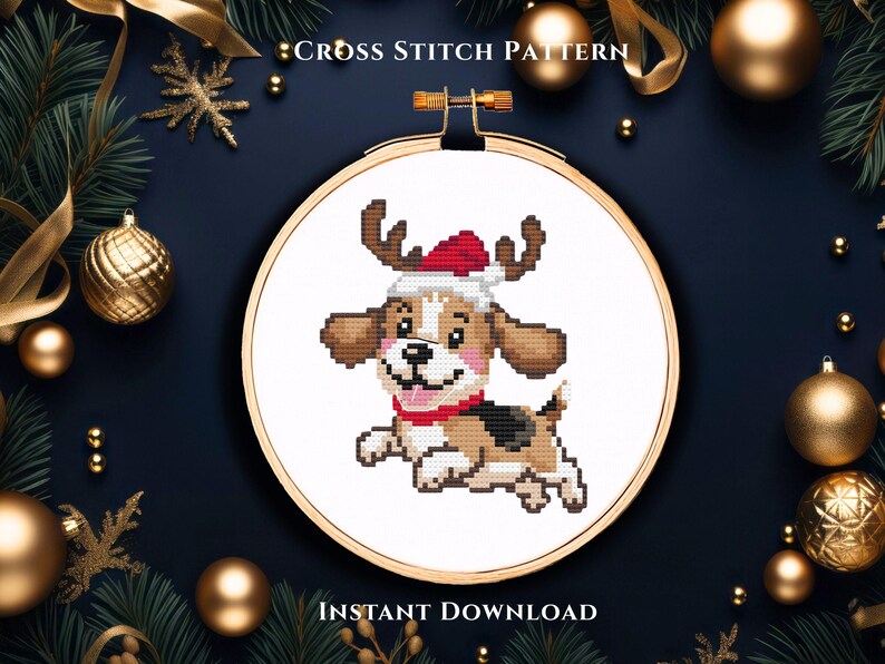 May include: A cross stitch pattern featuring a cartoon beagle dog wearing a red and white Santa hat with reindeer antlers. The design is displayed within a wooden embroidery hoop. The text reads CROSS STITCH PATTERN and INSTANT DOWNLOAD.