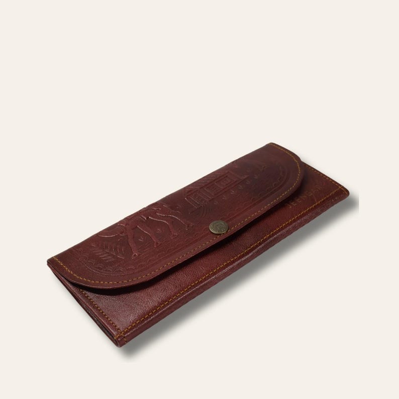 The Gangaur Clutch in Cherry, hand-embossed leather clutch, front view