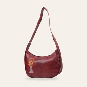 The Kashida Shoulder Bag, Padmini Tree of Life motif in Cherry, hand-embroidered real leather, front view