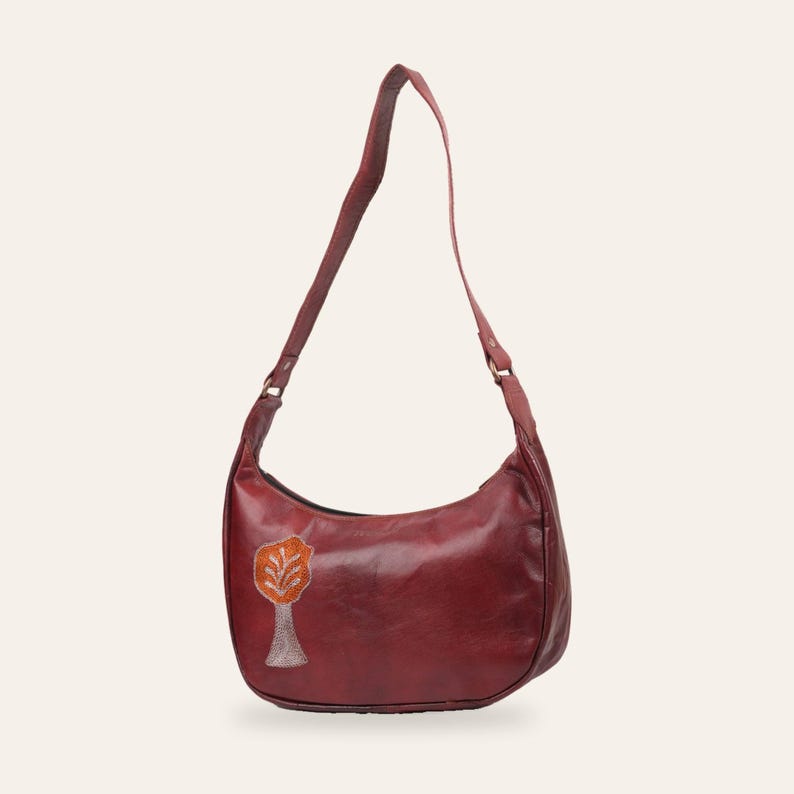 The Kashida Shoulder Bag, Padmini Tree of Life motif in Cherry, hand-embroidered real leather, front view