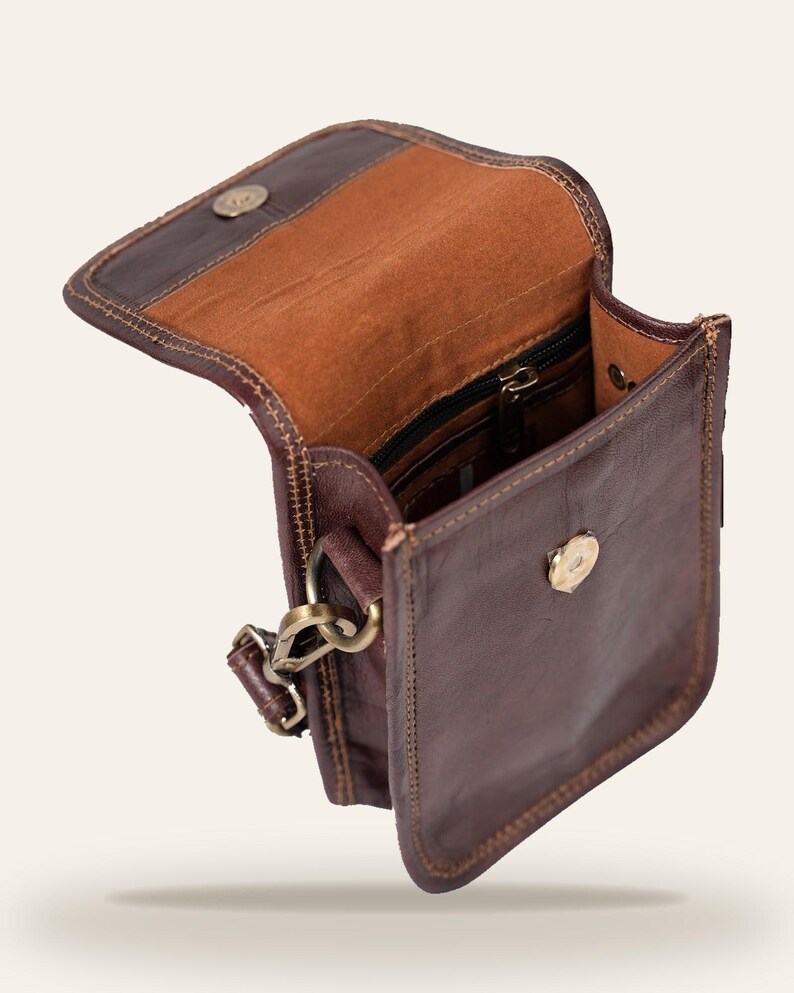 The Nagaur Kashidakari Sling opened, showing the velvet-lined interior and zip pocket