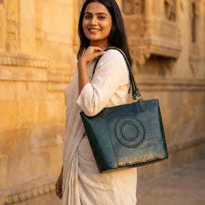 A woman carries The Rambagh Tote over one shoulder in Rajasthan's golden evening light (AI-generated)