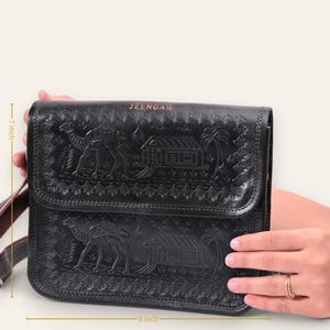 The Pushkar Sling in Dark Olive, embossed camel and desert dwelling motif