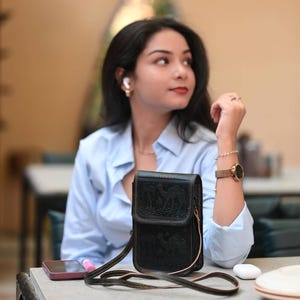 The Nagaur Sling in Dark Olive, embossed desert caravan motif on real leather