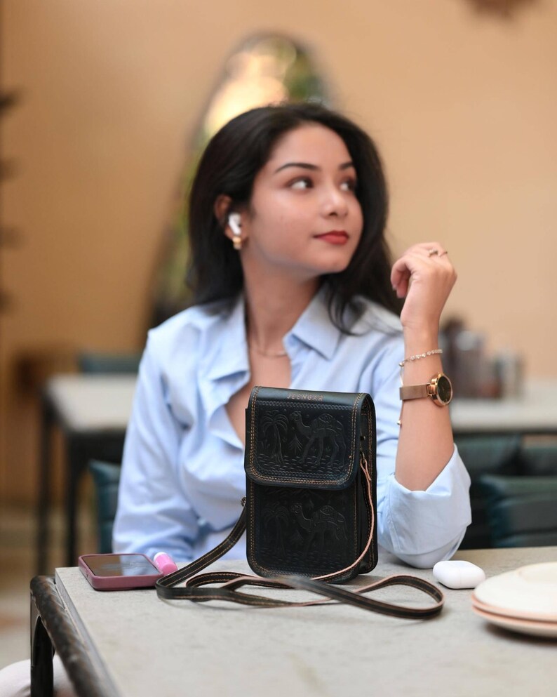 The Nagaur Sling in Dark Olive, embossed desert caravan motif on real leather