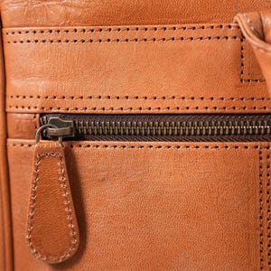 The Sonar Briefcase, stitched leather and antique-finish zip detail