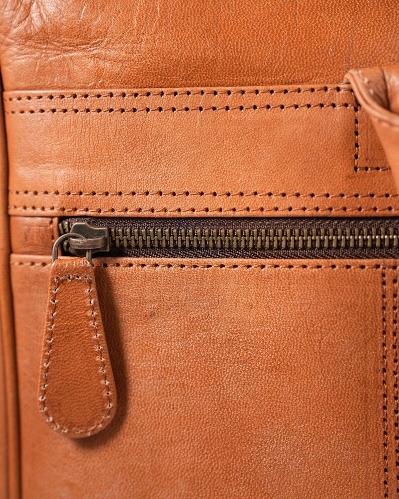The Sonar Briefcase, stitched leather and antique-finish zip detail
