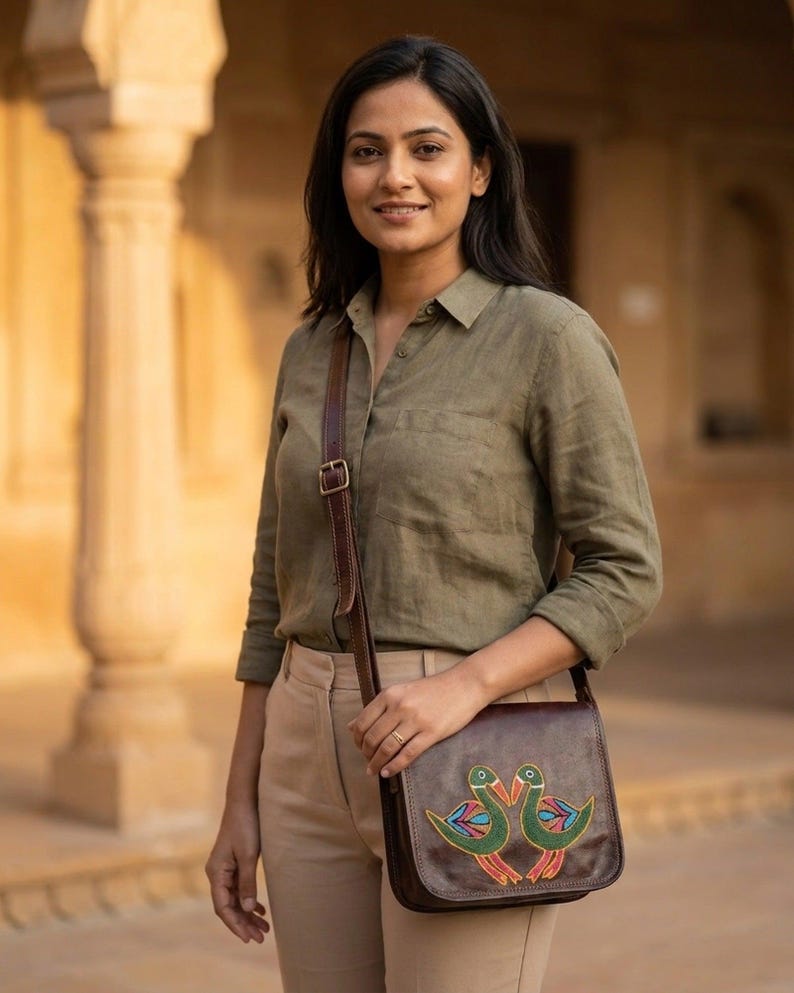 The Moruda Sling worn cross-body in warm afternoon light against Rajasthani sandstone (AI-generated)