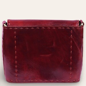 The Beawar Sling in Cherry, prominent saddle-stitch detail